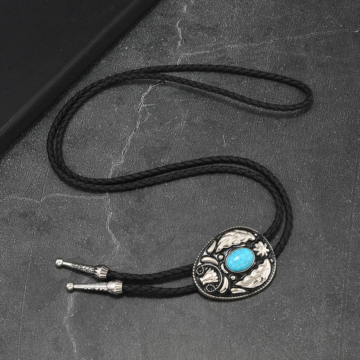Oval Turquoise Black-and-white Carved Metal Bolo Ties - image 3